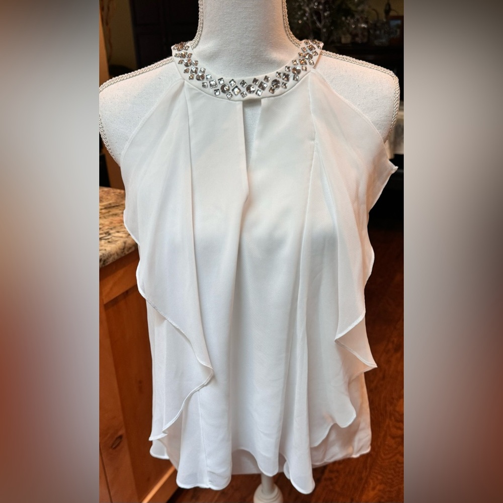 BCBG Maxazria sleeveless flowy blouse with rhinestones. Size XS.
NWT